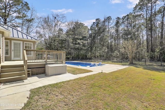 146 Olde Point Rd, Hampstead, NC 28443 - view of swimming pool with a wooden deck, a fenced backyard, a patio area, and view of wooded area