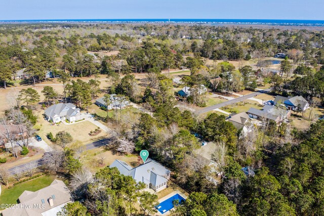 146 Olde Point Rd, Hampstead, NC 28443 - aerial overview of property's location featuring nearby suburban area and a tree filled landscape
