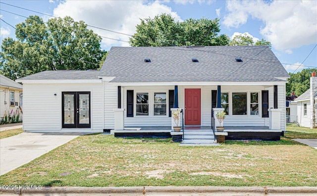 304 N Saratoga St, Stantonsburg, NC 27883 - bungalow with french doors, a front yard, a shingled roof, and a porch