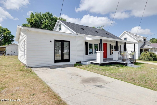 304 N Saratoga St, Stantonsburg, NC 27883 - bungalow-style home featuring french doors, a front lawn, and a porch