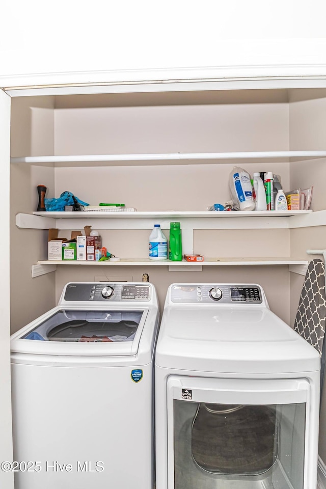 washroom with independent washer and dryer