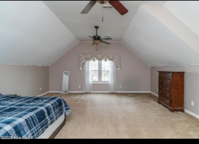 bedroom with baseboards, lofted ceiling, ceiling fan, and carpet flooring