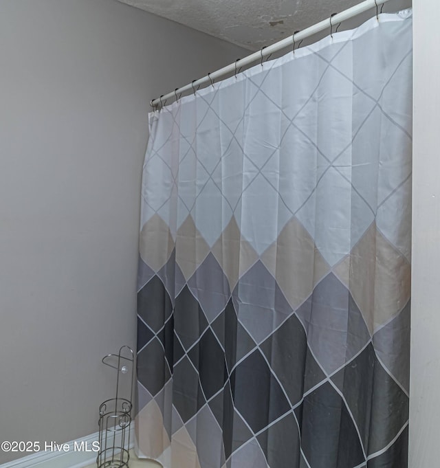 bathroom with curtained shower
