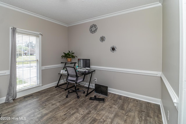 office area featuring visible vents, plenty of natural light, ornamental molding, and wood finished floors