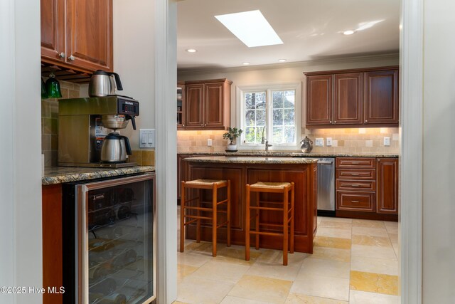 bar with dishwasher, backsplash, beverage cooler, and a skylight
