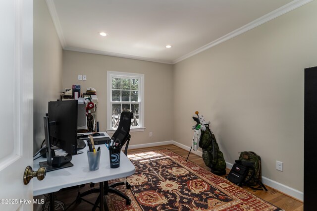 home office featuring baseboards, wood finished floors, and ornamental molding