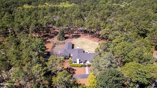 bird's eye view featuring a wooded view