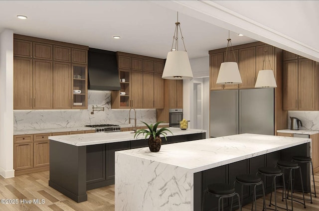 103 Chesterfield Dr, Pinehurst, NC 28374 - kitchen featuring an island with sink, custom exhaust hood, stainless steel built in fridge, tasteful backsplash, and light wood-style floors