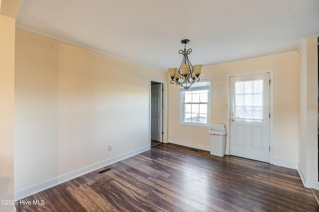 unfurnished dining area with visible vents, a notable chandelier, dark wood-style floors, and ornamental molding