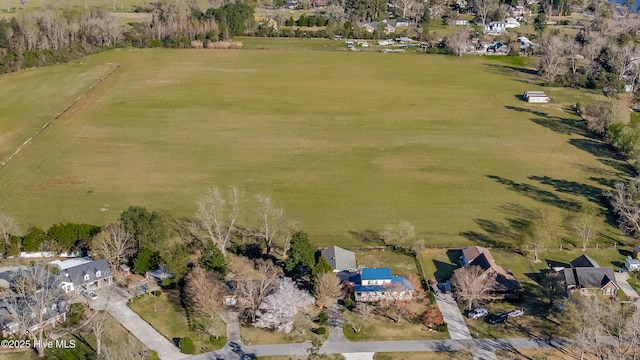 birds eye view of property featuring a rural view