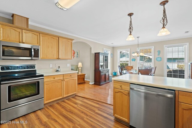 6 White Ln, Oak Island, NC 28465 - kitchen featuring light brown cabinetry, light wood-style floors, stainless steel appliances, and light countertops
