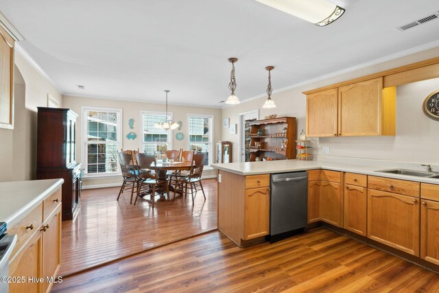 6 White Ln, Oak Island, NC 28465 - kitchen featuring dark wood-style flooring, visible vents, a peninsula, light countertops, and dishwasher