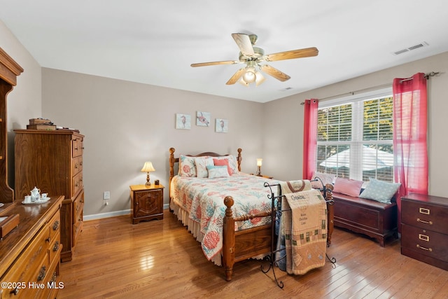 6 White Ln, Oak Island, NC 28465 - bedroom with a ceiling fan, visible vents, baseboards, and light wood-style floors