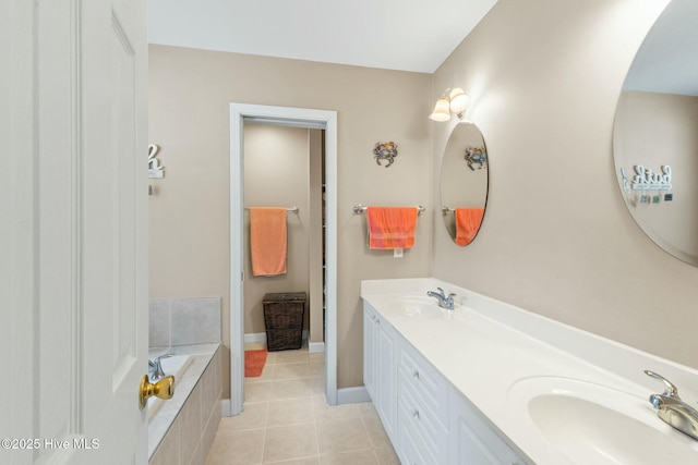 6 White Ln, Oak Island, NC 28465 - bathroom with tile patterned flooring, a sink, double vanity, and tiled tub