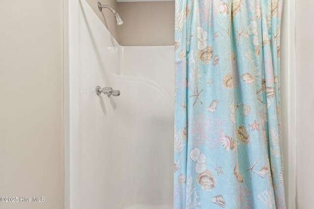 6 White Ln, Oak Island, NC 28465 - bathroom featuring curtained shower