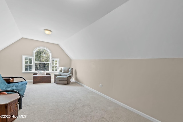 6 White Ln, Oak Island, NC 28465 - living area featuring baseboards, carpet floors, and lofted ceiling
