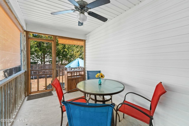 6 White Ln, Oak Island, NC 28465 - sunroom with ceiling fan and outdoor dining area