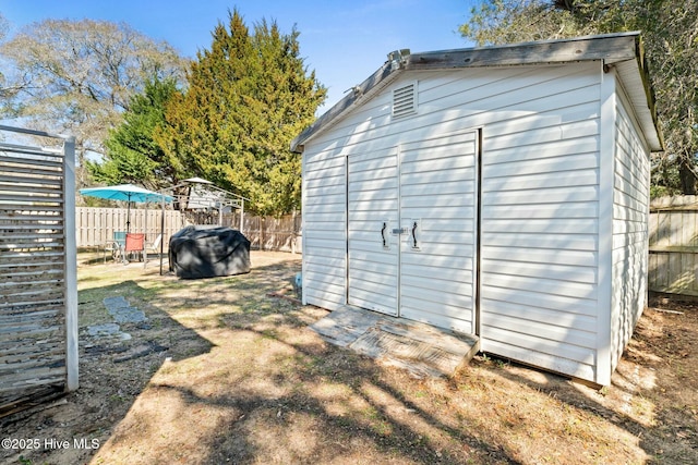 6 White Ln, Oak Island, NC 28465 - view of shed with a fenced backyard
