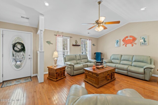 6 White Ln, Oak Island, NC 28465 - living room featuring a ceiling fan, visible vents, light wood-style flooring, baseboards, and lofted ceiling