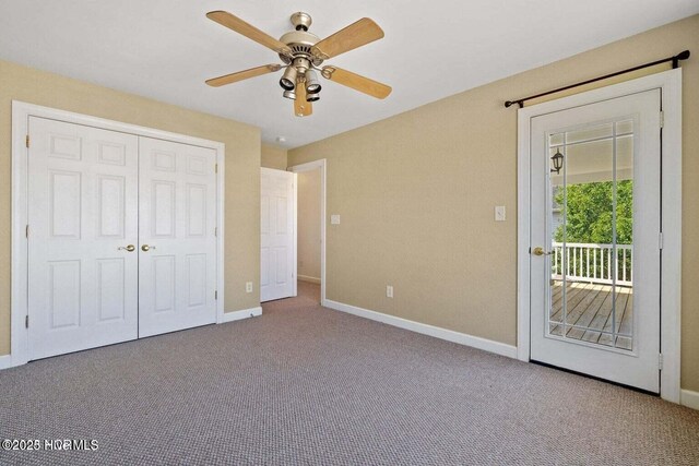 unfurnished bedroom featuring a ceiling fan, carpet, baseboards, a closet, and access to outside