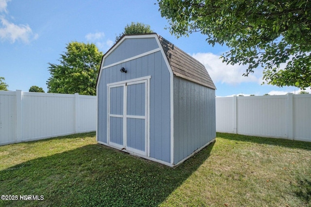 view of shed with a fenced backyard