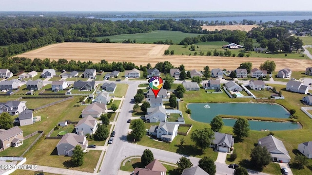 bird's eye view featuring a residential view and a water view