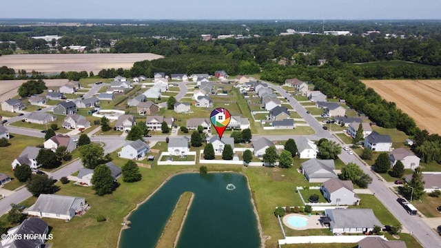 bird's eye view with a residential view and a water view