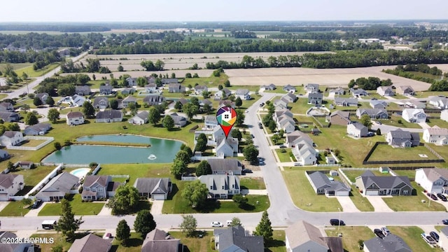 bird's eye view with a water view and a residential view