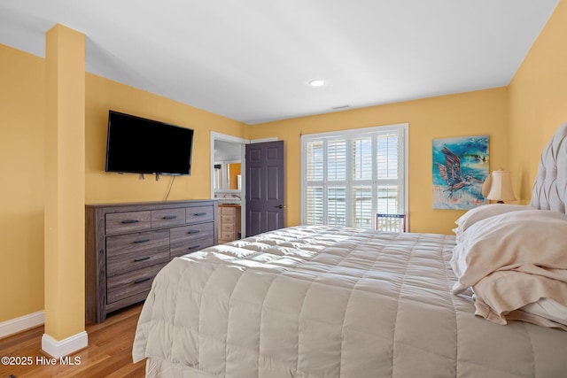bedroom featuring baseboards, recessed lighting, visible vents, and light wood-style floors