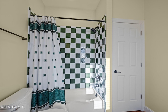 full bathroom featuring toilet and shower / bathtub combination with curtain