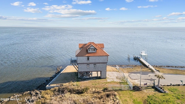 birds eye view of property with a water view