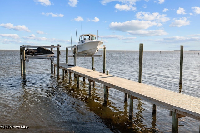 dock area featuring a water view and boat lift