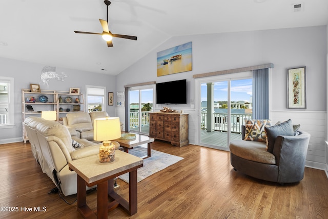 3617 W Pelican Dr, Oak Island, NC 28465 - living area featuring wood finished floors, visible vents, high vaulted ceiling, and ceiling fan