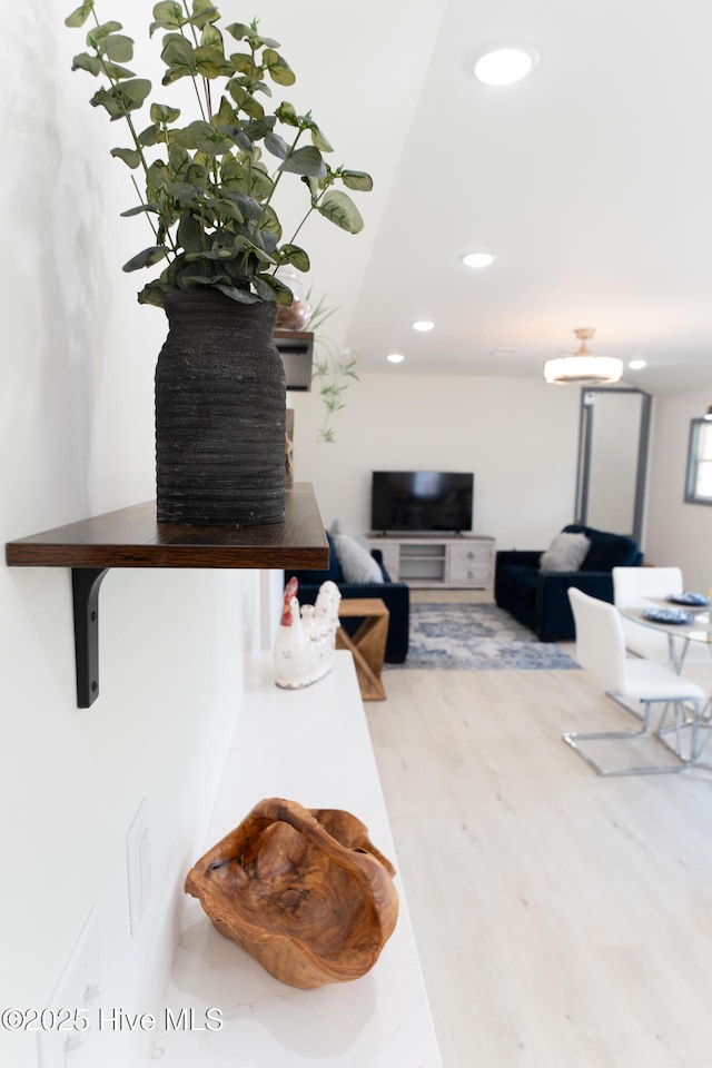 living area featuring wood finished floors and recessed lighting