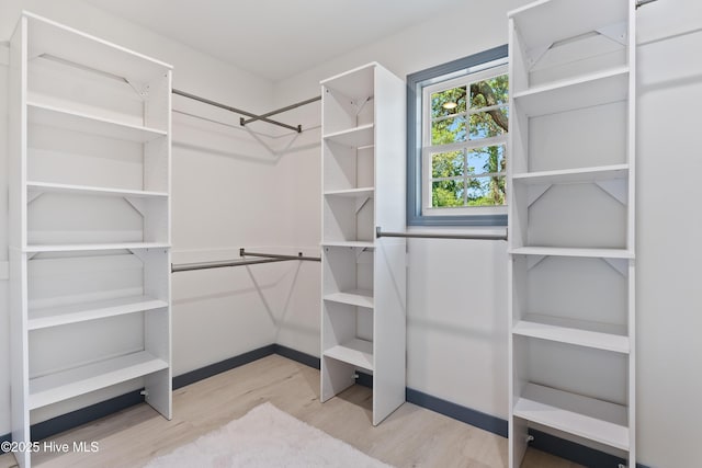 spacious closet with wood finished floors