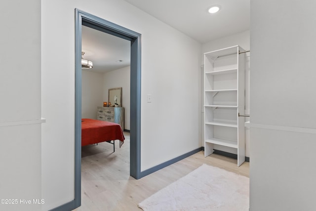 spacious closet with light wood-style flooring