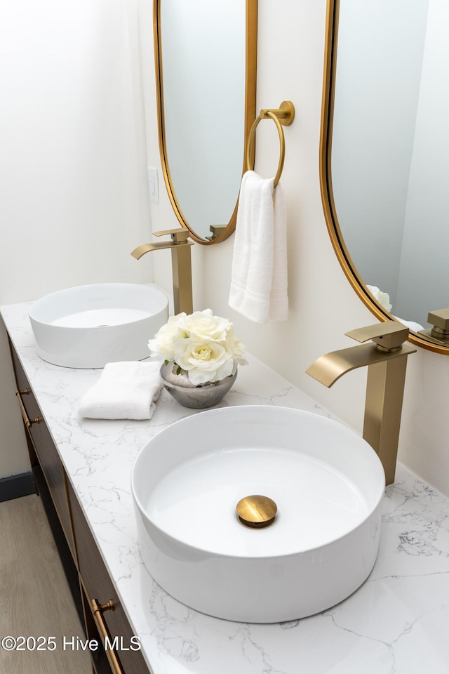 room details featuring a sink and double vanity