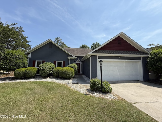 1123 Mill Run Rd, Sneads Ferry, NC 28460 - ranch-style house featuring concrete driveway, a shingled roof, a front yard, and a garage