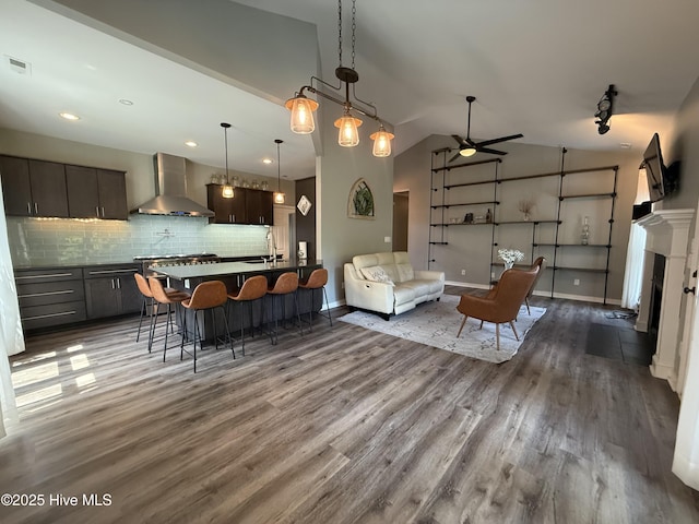 1123 Mill Run Rd, Sneads Ferry, NC 28460 - living area featuring a ceiling fan, visible vents, wood finished floors, baseboards, and lofted ceiling