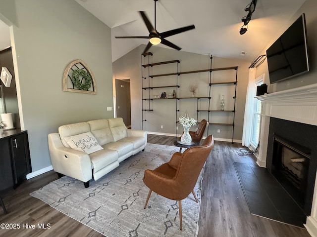 1123 Mill Run Rd, Sneads Ferry, NC 28460 - living room featuring a glass covered fireplace, baseboards, a ceiling fan, and dark wood-style flooring