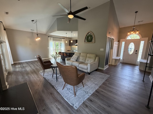 1123 Mill Run Rd, Sneads Ferry, NC 28460 - living area featuring ceiling fan, high vaulted ceiling, baseboards, visible vents, and dark wood-style floors