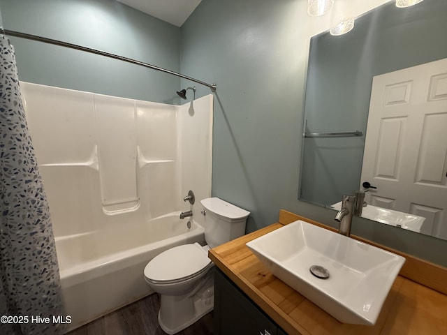 1123 Mill Run Rd, Sneads Ferry, NC 28460 - full bathroom featuring toilet, shower / bathtub combination with curtain, wood finished floors, and vanity