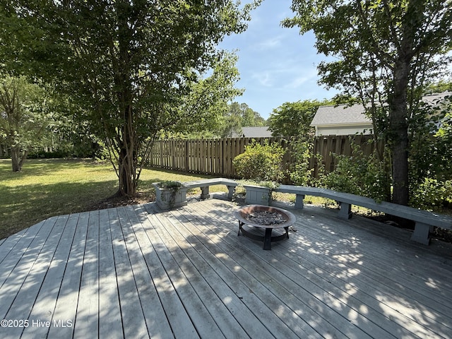 1123 Mill Run Rd, Sneads Ferry, NC 28460 - deck featuring a lawn, fence, and a fire pit
