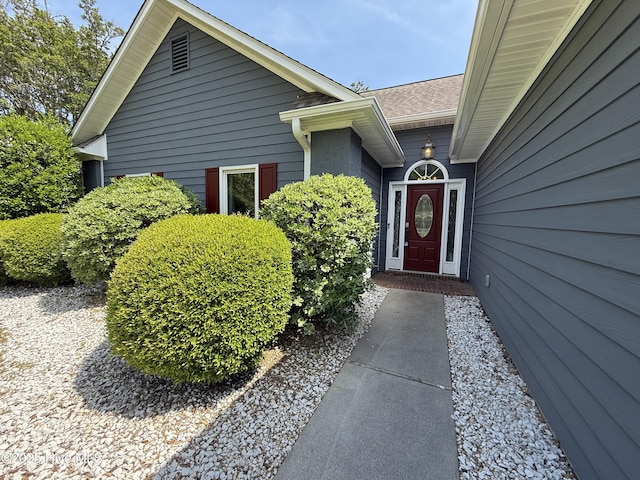 1123 Mill Run Rd, Sneads Ferry, NC 28460 - doorway to property featuring roof with shingles