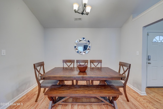 1414 Kellum Ct, Wilmington, NC 28412 - dining space featuring light wood-style flooring, baseboards, and a chandelier