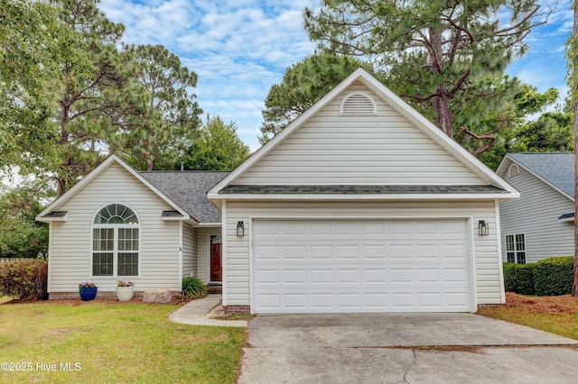 1414 Kellum Ct, Wilmington, NC 28412 - view of front facade featuring driveway, a shingled roof, a front yard, and an attached garage