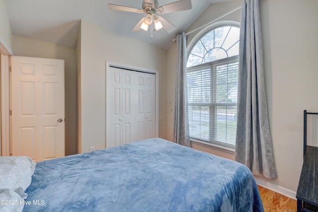 1414 Kellum Ct, Wilmington, NC 28412 - bedroom with multiple windows, vaulted ceiling, wood finished floors, baseboards, and a closet