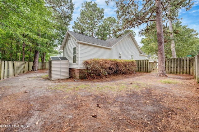 1414 Kellum Ct, Wilmington, NC 28412 - view of side of property featuring a fenced backyard and roof with shingles