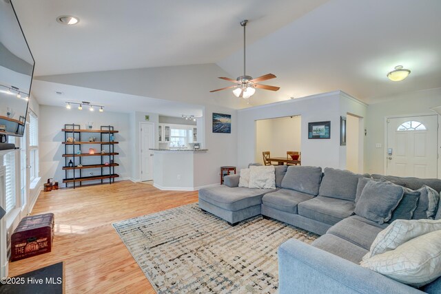1414 Kellum Ct, Wilmington, NC 28412 - living area with light wood finished floors, a ceiling fan, lofted ceiling, and baseboards