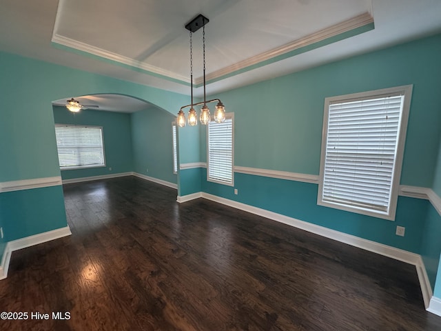 427 Wolfe Ln, Hubert, NC 28539 - unfurnished room featuring a tray ceiling, arched walkways, wood finished floors, and crown molding